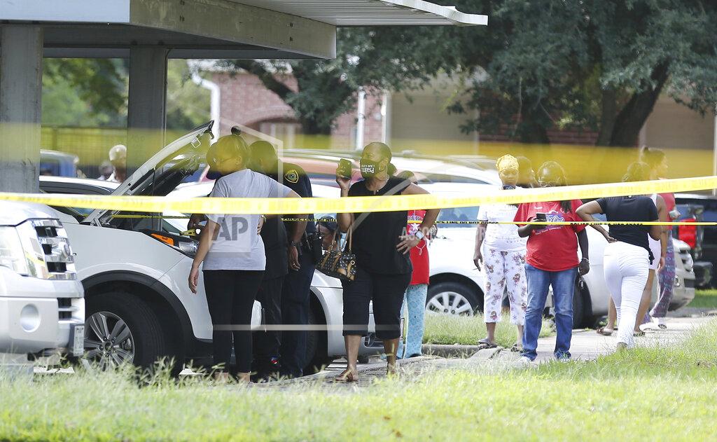 Elizabeth Conley Police investigate a shooting Timber Ridge Apartments in Houston on Monday, Sept. 20, 2021. Authorities say a Houston police officer was killed and another was wounded during a shooting that also killed a 31-year-old man who the officers were attempting to arrest. (Elizabeth Conley/Houston Chronicle via AP)