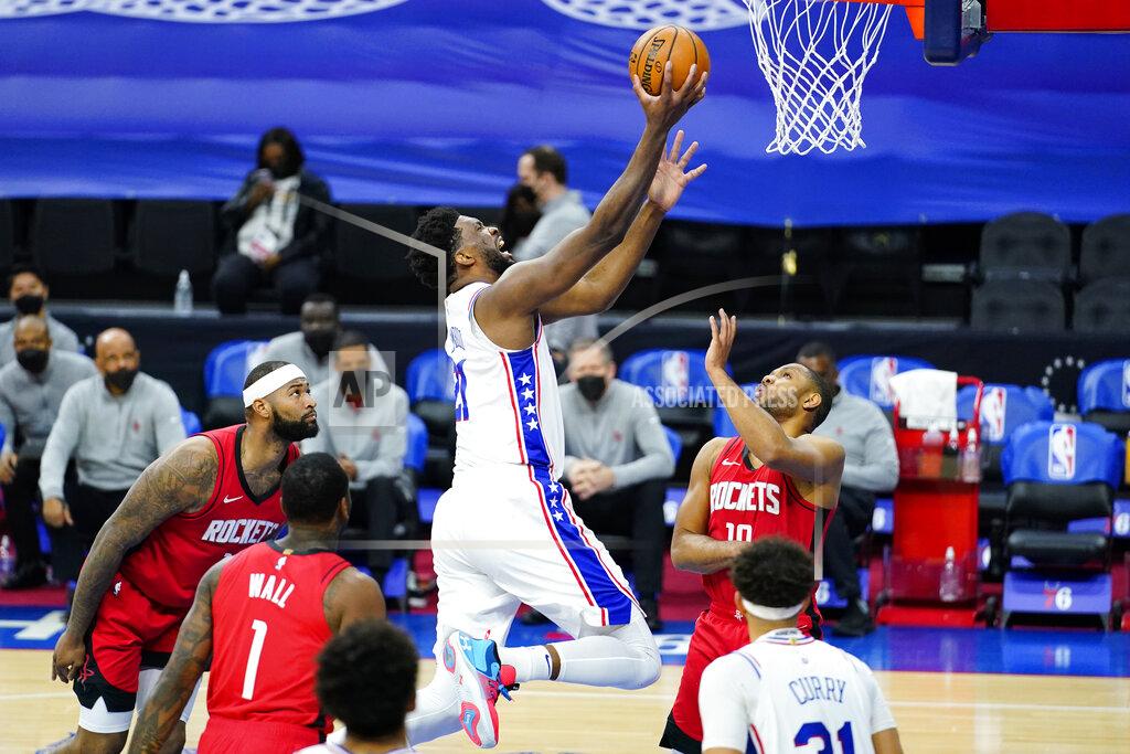 Matt Slocum Philadelphia 76ers' Joel Embiid, center, goes up for a shot against Houston Rockets' Eric Gordon, right, during the second half of an NBA basketball game, Wednesday, Feb. 17, 2021, in Philadelphia. (AP Photo/Matt Slocum)