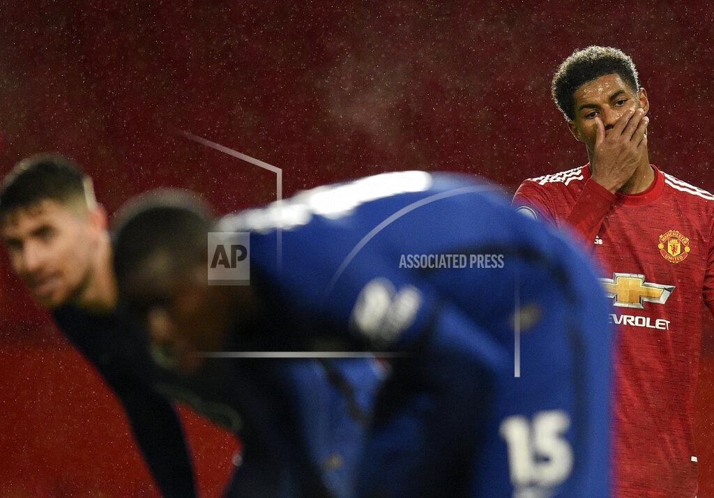 Oli Scarff Manchester United's Marcus Rashford, right, reacts during the English Premier League soccer match between Manchester United and Chelsea, at the Old Trafford stadium in Manchester, England, Saturday, Oct. 24, 2020. (Oli Scarff/Pool via AP)