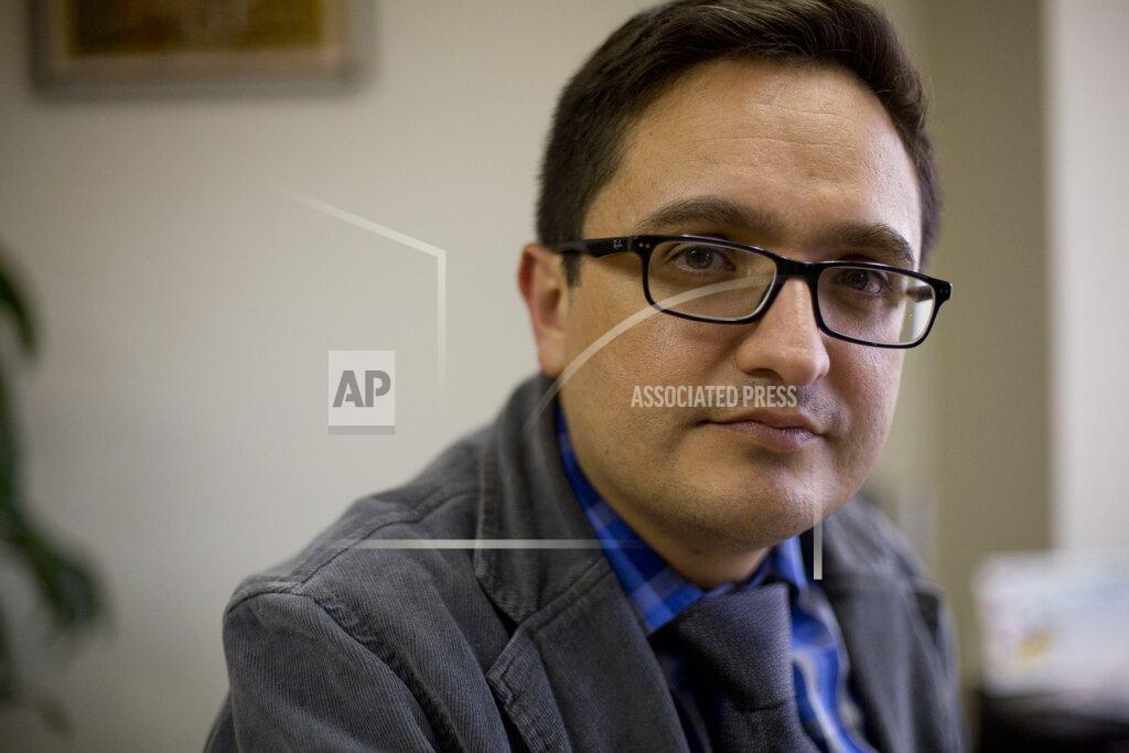 Moises Castillo FILE - In this April 3, 2019 file photo, Juan Francisco Sandoval, Guatemala's lead prosecutor against impunity, poses for a photo during an interview in Guatemala City. Guatemalan officials confirmed on Sept. 3, 2021 that they're trying to arrest Sandoval, the former anti-corruption prosecutor whose ouster led the U.S. to reduce cooperation with Guatemala's legal system, while under investigation for allegedly leaking confidential information. (AP Photo/Moises Castillo, File)