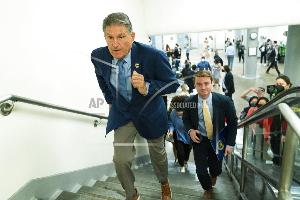 Manuel Balce Ceneta Sen. Joe Manchin, D-W.Va., jogs up the steps on Capitol Hill in Washington, Thursday, Aug. 4, 2022. (AP Photo/Manuel Balce Ceneta)