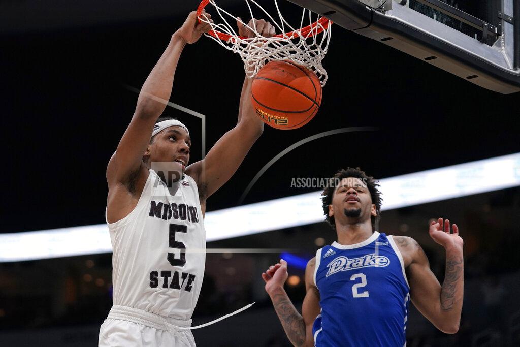 Jeff Roberson Missouri State's Donovan Clay (5) dunks over Drake's Tremell Murphy (2) during the second half of an NCAA college basketball game in the semifinal round of the Missouri Valley Conference tournament Saturday, March 5, 2022, in St. Louis. Drake won 79-78. (AP Photo/Jeff Roberson)