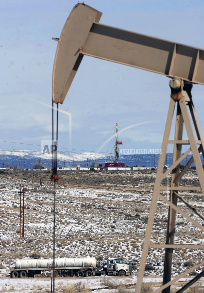 FILE - This Feb. 21, 2012, file photo, shows equipment in the oil fields of the Uintah Basin, southeast of Vernal, Utah. The Trump administration has started giving energy companies temporary breaks on royalties they must pay for oil and gas extracted from federal lands because of the coronavirus pandemic, government data shows. Royalty rate cuts so far have been authorized for at least 76 energy leases in Utah. (Trent Nelson/The Salt Lake Tribune via AP, File)