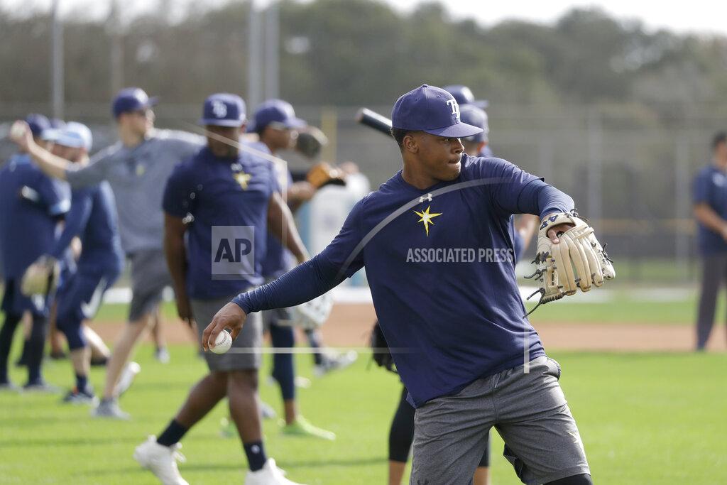 John Bazemore FILE - Tampa Bay Rays pitchers and catchers throw after reporting for spring training baseball camp in Port Charlotte, Fla., in this Wednesday, Feb. 12, 2020, file photo. Big league managers say that Major League Baseball has instructed them to prepare for spring training to start on time in mid-February despite uncertainty around the coronavirus. Tampa Bay Rays manager Kevin Cash said Wednesday, Dec. 16, 2020, that officials from the commissioner's office had a meeting with managers Tuesday an expressed optimism about opening spring camps as scheduled. (AP Photo/John Bazemore, File)