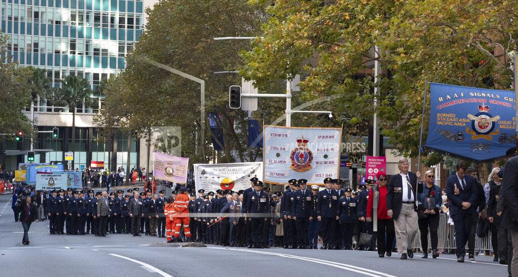 Mark Baker Veterans march during the Anzac Day parade in Sydney, Australia, Sunday, April 25, 2021. Australians and New Zealanders paid tribute to their war dead Sunday as both nations prepared to withdraw from their longest war in Afghanistan. (AP Photo/Mark Baker)