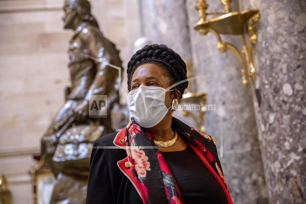 Andrew Harnik Rep. Sheila Jackson Lee, D-Texas, wears a mask and speaks to a reporter as she walks towards the House Chamber on Capitol Hill, Thursday, April 23, 2020, in Washington. The House is expected to vote on a nearly $500 billion Coronavirus relief bill. (AP Photo/Andrew Harnik)