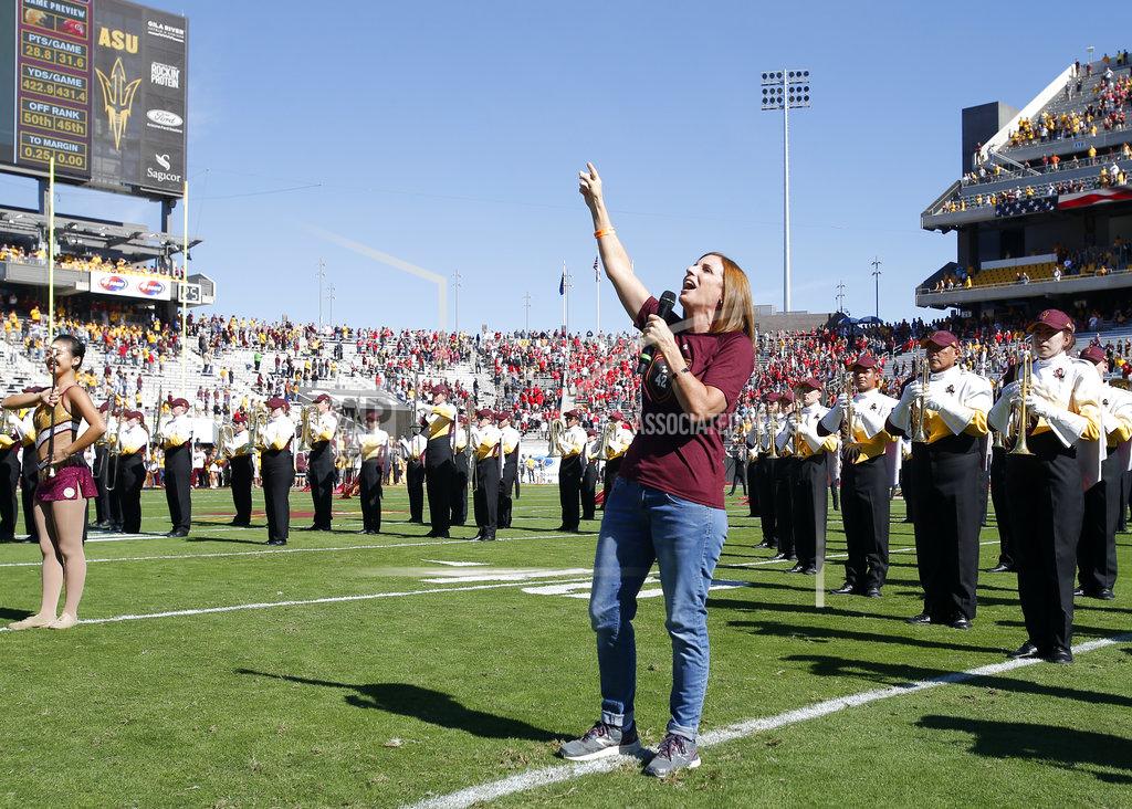 Rick Scuteri U.S. Rep. Martha McSally, R-Ariz. sings the national anthem before an NCAA college football game between Arizona State and Utah, Saturday, Nov. 3, 2018, in Tempe, Ariz. (AP Photo/Rick Scuteri)