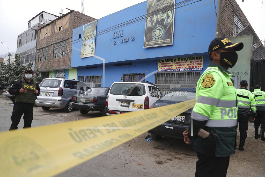 Martin Mejia Police officers guard the perimeter of the Tomas Restobar disco where officials say 13 people died in a stampede after a police raid to enforce the country's lockdown during the coronavirus pandemic, Sunday, Aug. 23, 2020. The stampede happened when about 120 people that had gathered for a party on Saturday night, tried to escape through the only door of the second-floor disco, trampling one another and becoming trapped in the confined space, according to authorities. (AP Photo/Martin Mejia)