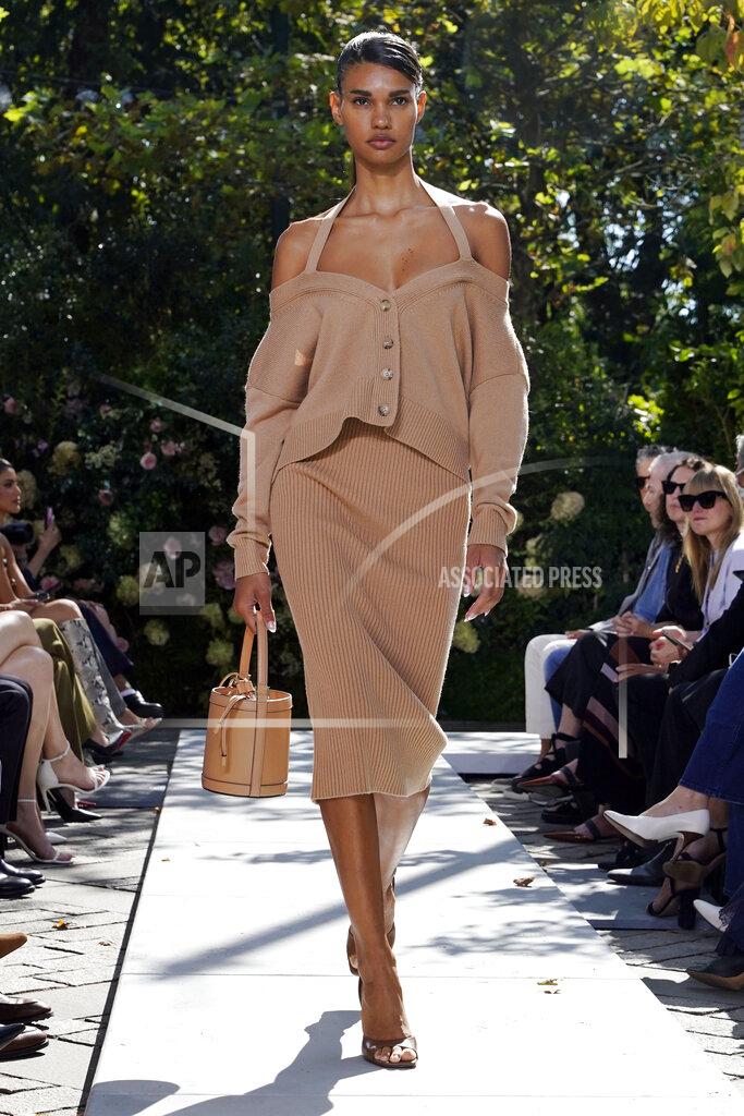 Richard Drew The Michael Kors Spring/Summer 2022 collection is modeled during Fashion Week in New York, Friday, Sept. 10, 2021. (AP Photo/Richard Drew)
