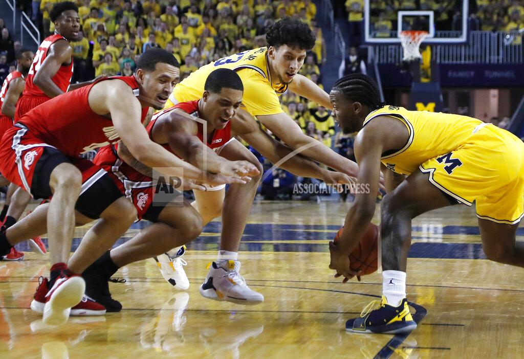 Carlos Osorio Michigan guard Zavier Simpson, right, steals the ball away from Ohio State forward Jaedon LeDee, center left, during the first half of an NCAA college basketball game Tuesday, Jan. 29, 2019, in Ann Arbor, Mich. (AP Photo/Carlos Osorio)