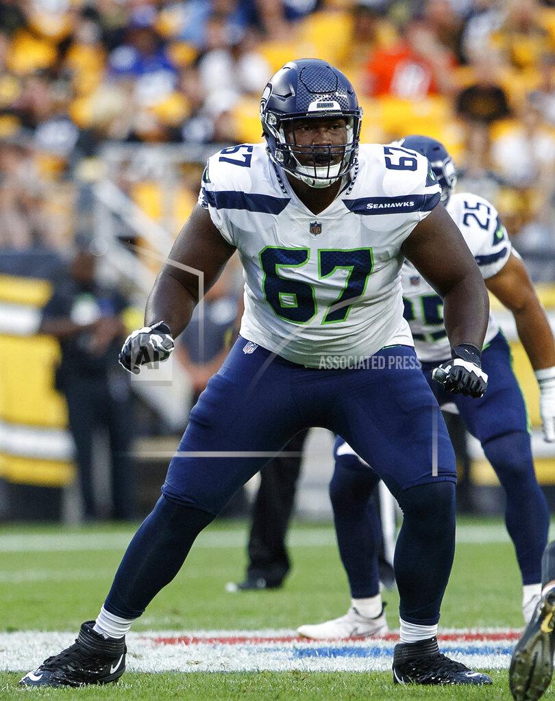 Matt Durisko FILE - Seattle Seahawks offensive tackle Charles Cross (67) looks to block against the Pittsburgh Steelers during a preseason NFL football game, Saturday, Aug. 13, 2022, in Pittsburgh, Pa. Charles Cross and Abe Lucas were drafted to be the bookends to the Seattle Seahawks offensive now and in the future. (AP Photo/Matt Durisko, File)
