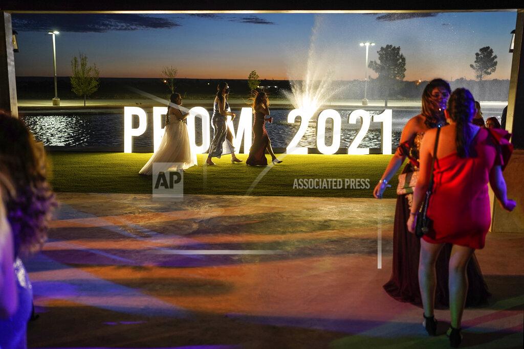 Paul Ratje Young people attend prom at the Grace Gardens Event Center in El Paso, Texas on Friday, May 7, 2021. Around 2,000 attended the outdoor event at the private venue after local school districts announced they would not host proms this year. Tickets cost $45. (AP Photo/Paul Ratje)