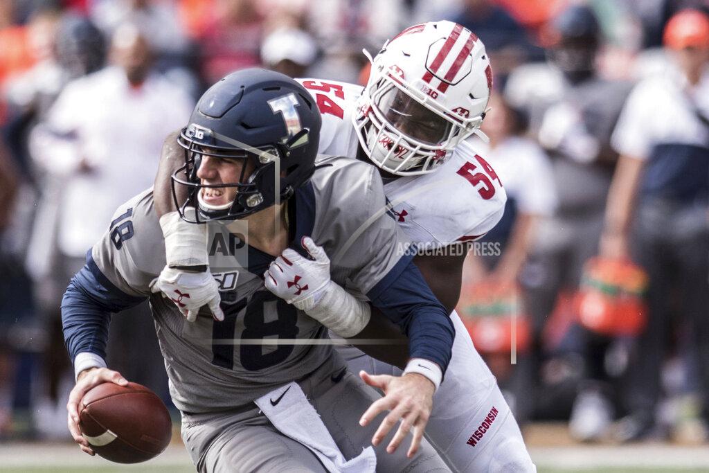 Illinois quarterback Brandon Peters (18) is sacked by Wisconsin's Chris Orr (54) in the second half of an NCAA college football game, Saturday, Oct.19, 2019, in Champaign, Ill. (AP Photo/Holly Hart)