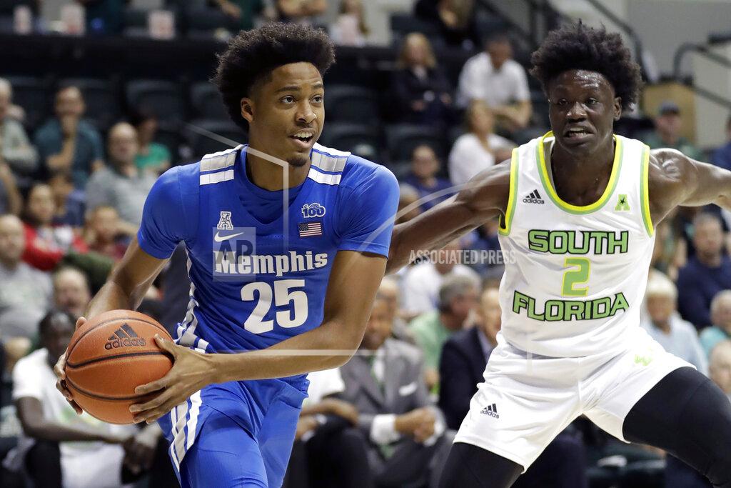 Chris O'meara Memphis guard Jayden Hardaway (25) drives around South Florida guard Ezacuras Dawson III (2) during the first half of an NCAA college basketball game Sunday, Jan. 12, 2020, in Tampa, Fla. (AP Photo/Chris O'Meara)
