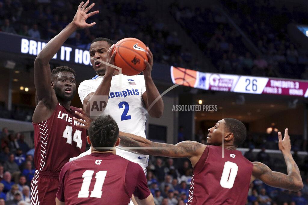 Karen Pulfer Focht Memphis' Alex Lomax (2) gets a rebound as Little Rock's Ben Coupet Jr. (0) and Ruot Monyyong (44) defend during the second half of an NCAA college basketball game Wednesday, Nov. 20, 2019, in Memphis, Tenn. (AP Photo/Karen Pulfer Focht)