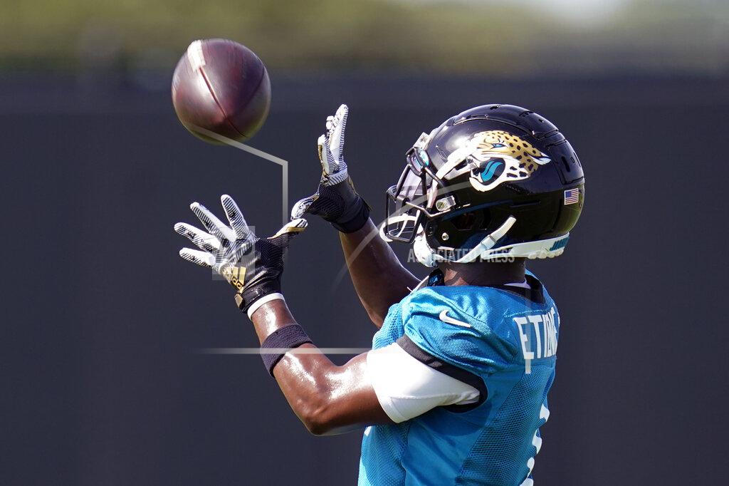 John Raoux Jacksonville Jaguars running back Travis Etienne makes a reception during NFL football practice, Friday, Aug. 6, 2021, in Jacksonville, Fla. (AP Photo/John Raoux)