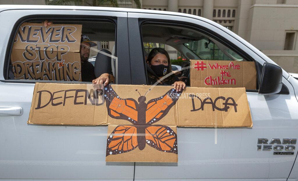 Damian Dovarganes FILE - In this June 18, 2020, file photo, people hold signs during a vehicle caravan rally to support the Deferred Action for Childhood Arrivals Program (DACA), around MacArthur Park in Los Angeles. Immigrant rights activists energized by a new Democratic administration and majorities on Capitol Hill are gearing up for a fresh political battle. A coalition of national advocacy groups on Monday announced a multimillion-dollar campaign to help push through President Joe Biden’s plan to open a citizenship pathway for up to 11 million people. (AP Photo/Damian Dovarganes, File)