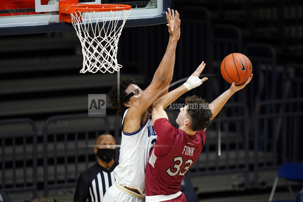 Matt Slocum Saint Joseph's Taylor Funk, right, tries to get a shot past Villanova's Jeremiah Robinson-Earl during the second half of an NCAA college basketball game, Saturday, Dec. 19, 2020, in Villanova, Pa. (AP Photo/Matt Slocum)