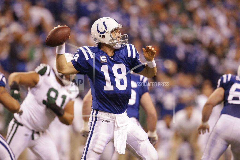 Nam Y. Huh File-This Jan. 8, 2011, file photo shows Indianapolis Colts quarterback Peyton Manning (18) in action during the second quarter of an NFL AFC wild card football playoff game in Indianapolis. Members of a special panel of 26 selected all of them for the position as part of the NFL's celebration of its 100th season. All won league titles except Marino. All are in the Hall of Fame except Brady and Manning, who are not yet eligible. On Friday, Dec. 27, 2019, quarterback was the final position revealed for the All-Time Team. (AP Photo/Nam Y. Huh,File)