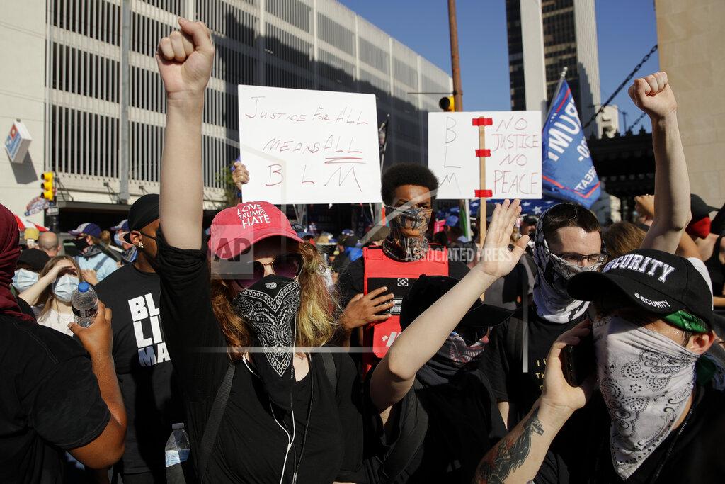 Charlie Riedel Protesters demonstrate outside the BOK Center where President Trump will hold a campaign rally in Tulsa, Okla., Saturday, June 20, 2020. (AP Photo/Charlie Riedel)