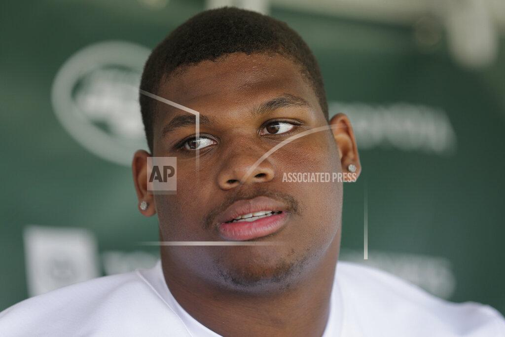 Seth Wenig FILE - In this July 26, 2019, file photo, New York Jets' Quinnen Williams speaks to reporters after a practice at the NFL football team's training camp in Florham Park, N.J. Jets defensive lineman Quinnen Williams was ticketed and given a court date after trying to board a plane at New York's LaGuardia Airport while carrying a gun, authorities said Friday, March 6, 2020. (AP Photo/Seth Wenig, File)