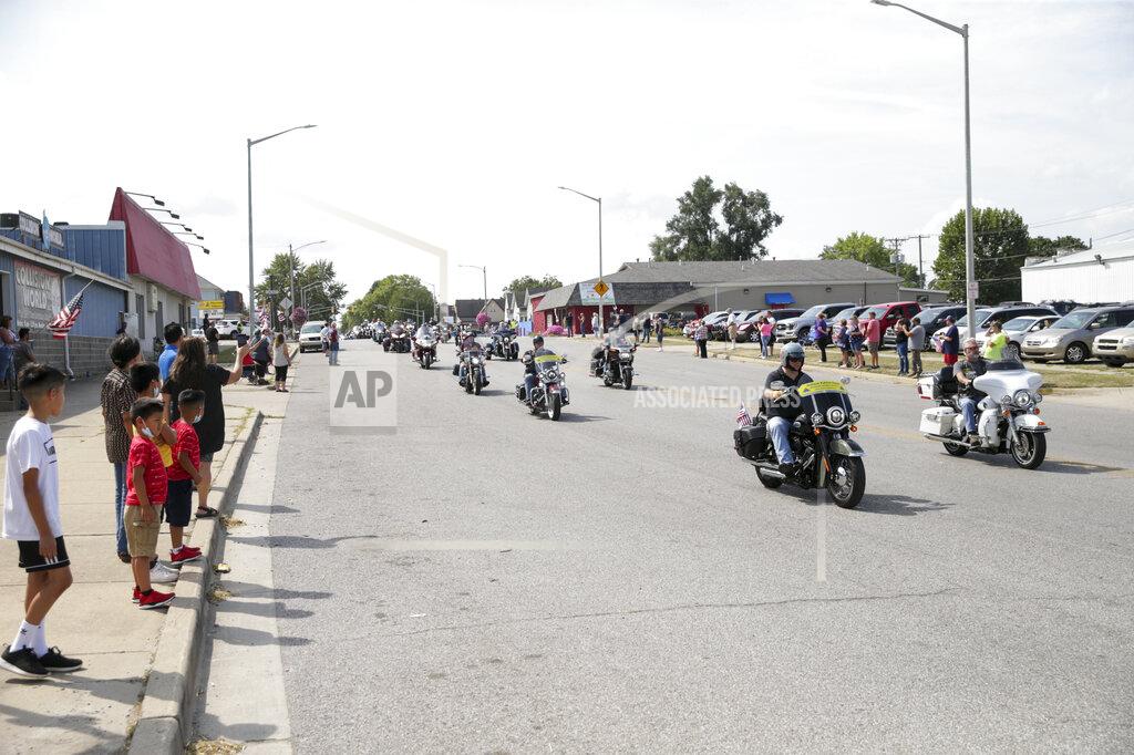 Nikos Frazier Motorcycles drive along Burlington Avenue during the funeral procession for Marine Cpl. Humberto "Bert" Sanchez, Tuesday, Sept. 14, 2021 in Logansport, Ind. Sanchez was one of 13 U.S. service members to die in an explosion during evacuation efforts in Afghanistan. (Nikos Frazier/Journal & Courier via AP)