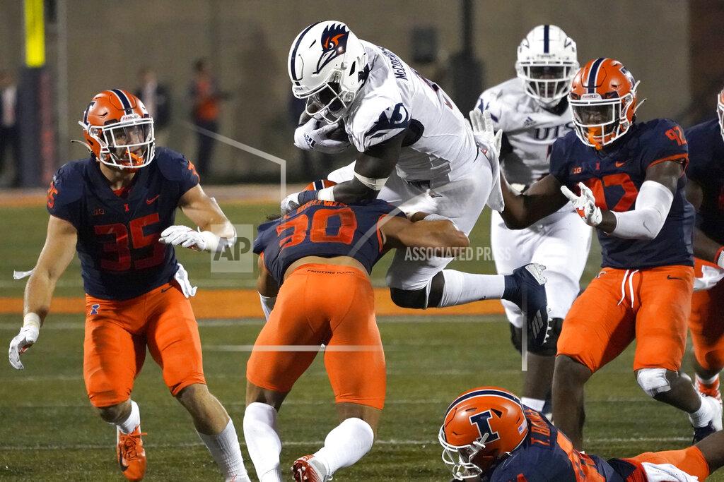 Charles Rex Arbogast UTSA running back Sincere McCormick, top center, is upended by Illinois defensive back Sydney Brown (30) during the first half of an NCAA college football game Saturday, Sept. 4, 2021, in Champaign, Ill. (AP Photo/Charles Rex Arbogast)
