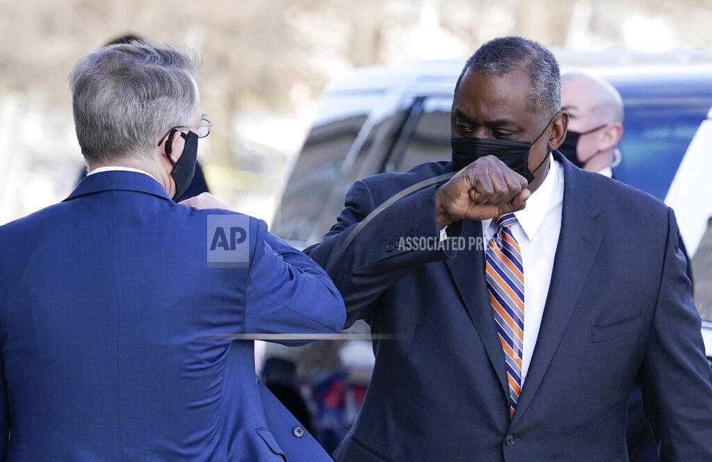 Alex Brandon Defense Secretary Lloyd Austin, right, greets Deputy Secretary of Defense David Norquist as he arrives at the Pentagon, Friday, Jan. 22, 2021, in Washington. (AP Photo/Alex Brandon)