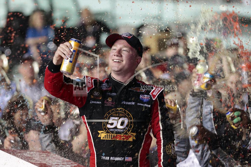 Luis M. Alvarez Tyler Reddick celebrates in Victory Lane after winning the NASCAR Xfinity Series auto racing championship at Homestead-Miami Speedway in Homestead, Fla. Saturday, Nov. 16, 2019. (AP Photo/Luis M. Alvarez)