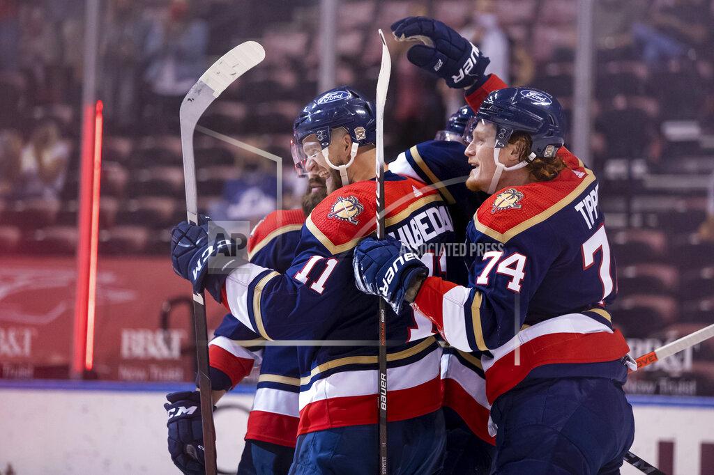 Mary Holt Florida Panthers left wing Jonathan Huberdeau (11) celebrates with right wing Owen Tippett (74) after scoring a goal during the second period of an NHL hockey game against the Tampa Bay Lightning, Saturday, May 8, 2021, in Sunrise, Fla. (AP Photo/Mary Holt)