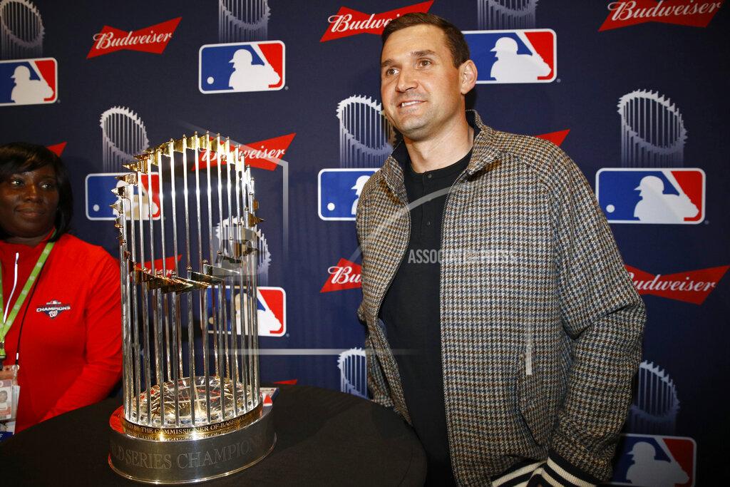 Patrick Semansky FILE - In this Dec. 2, 2019, file photo, Washington Nationals first baseman Ryan Zimmerman poses with the World Series trophy in Washington. With baseball on hold because of the coronavirus pandemic, Zimmerman occasionally will offer his thoughts via diary entries published by the AP, while waiting for the 2020 season to begin. (AP Photo/Patrick Semansky, File)