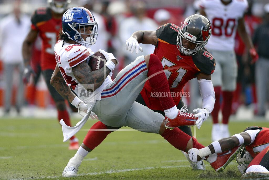 Jason Behnken New York Giants tight end Evan Engram (88) gets knocked down by Tampa Bay Buccaneers linebacker Kevin Minter (51) during the first half of an NFL football game Sunday, Sept. 22, 2019, in Tampa, Fla. (AP Photo/Jason Behnken)