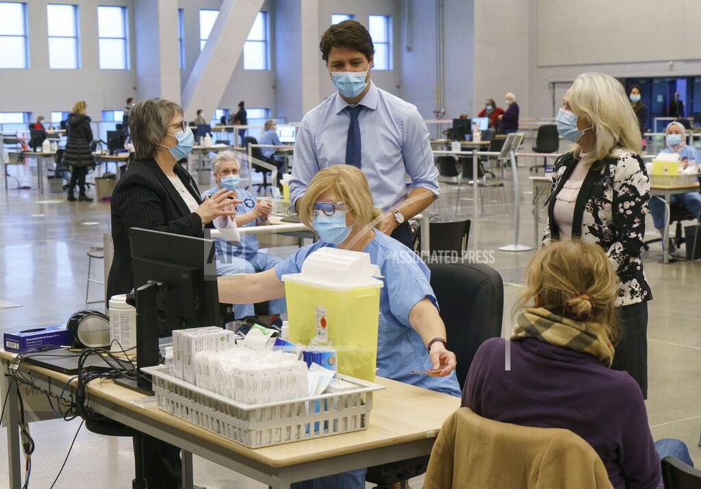 Paul Chiasson Canada's Prime Minister Justin Trudeau tours a COVID-19 vaccination clinic in Montreal on Monday, March 15, 2021. (Paul Chiasson/The Canadian Press via AP)