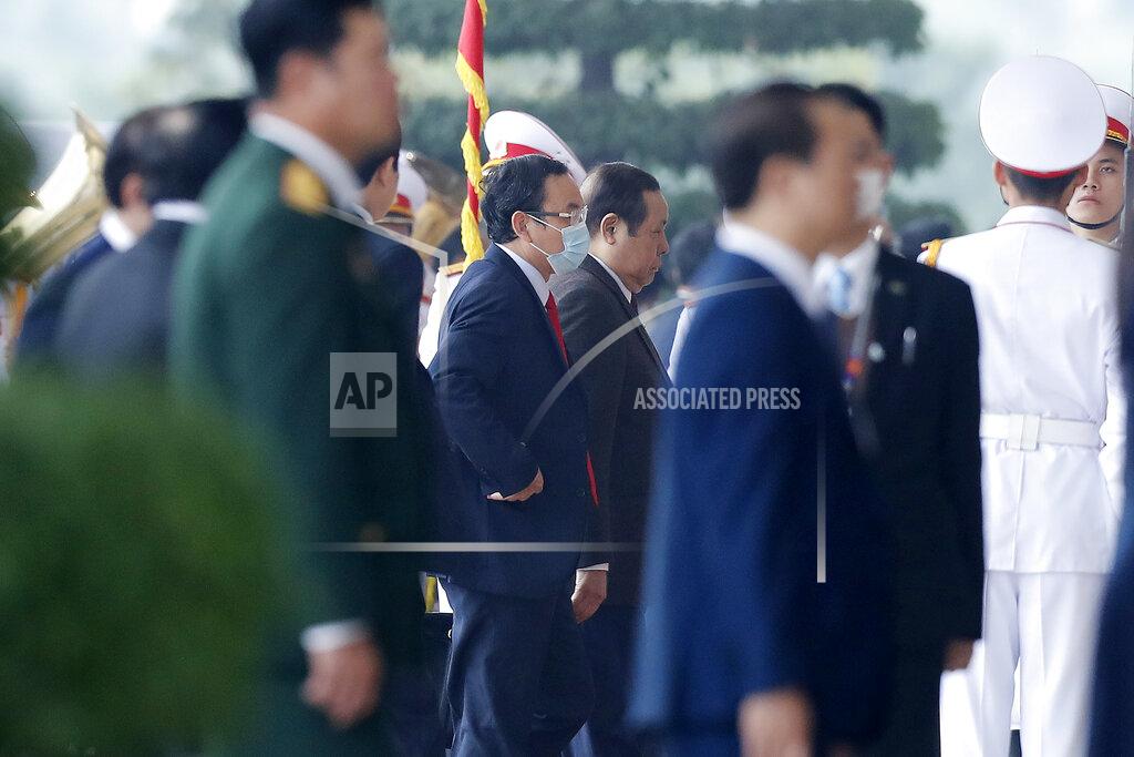 Minh Hoang Nguyen Van Nen, center, secretary of the Ho Chi Minh City Party Committee arrives for the opening ceremony of the 13th National Congress of Vietnam's Communist Party (VCP), in Hanoi, Vietnam Tuesday, Jan. 26, 2021. (AP Photo/Minh Hoang)
