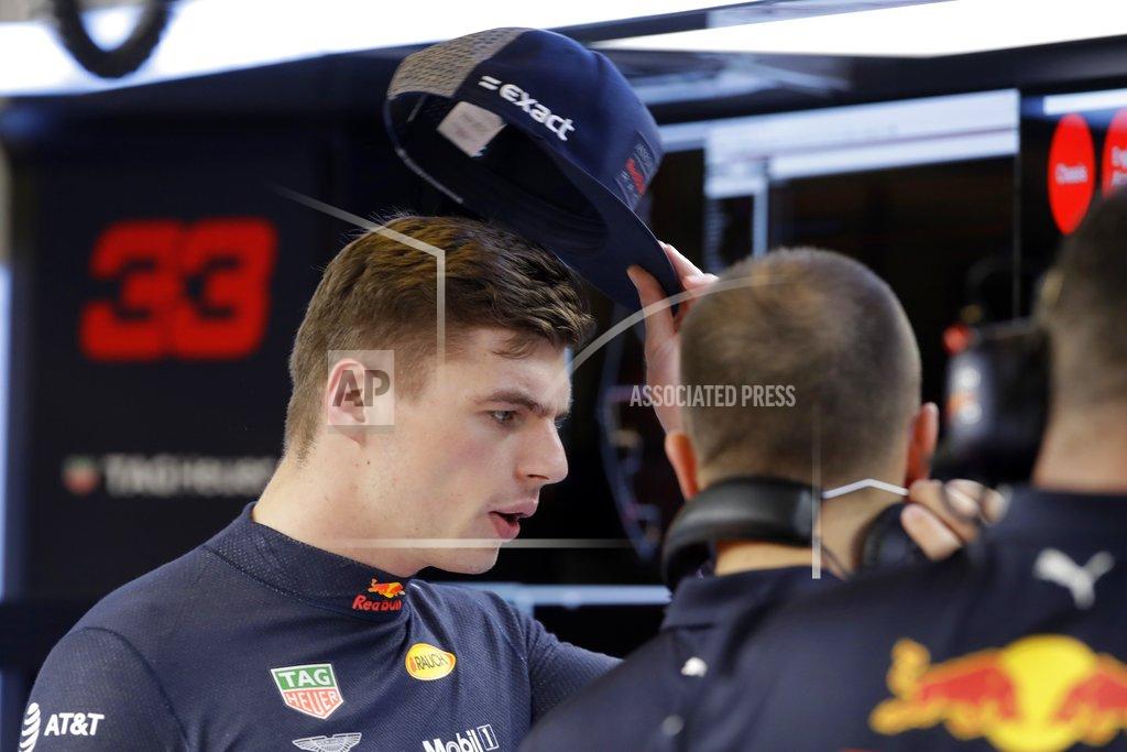 Luca Bruno Red Bull driver Max Verstappen of the Netherlands speaks with a technician in the team's box during the second free practice at the Yas Marina racetrack in Abu Dhabi, United Arab Emirates, Friday Nov. 23, 2018. The Emirates Formula One Grand Prix will take place on Sunday. (AP Photo/Luca Bruno)