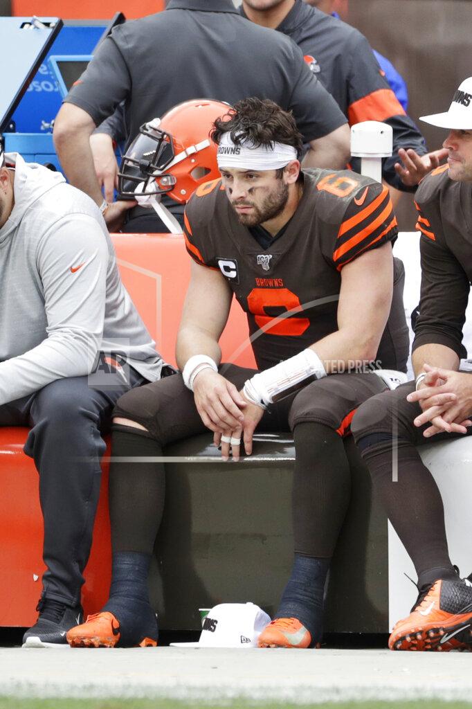 Ron Schwane Cleveland Browns quarterback Baker Mayfield sits on the sidelines during the second half in an NFL football game against the Tennessee Titans, Sunday, Sept. 8, 2019, in Cleveland. The Titans won 43-13. (AP Photo/Ron Schwane)