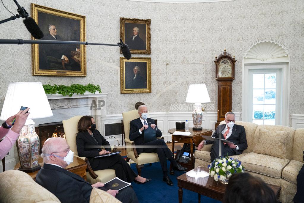 Evan Vucci Vice President Kamala Harris, President Joe Biden, and Senate Majority Leader Sen. Chuck Schumer of N.Y., meet to discuss a coronavirus relief package, in the Oval Office of the White House, Wednesday, Feb. 3, 2021, in Washington. (AP Photo/Evan Vucci)