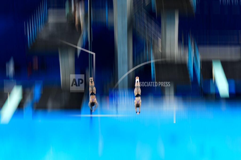 Morry Gash Mun Yen Leong and Pandelela of Malaysia compete during the women's synchronised 10-meter platform final at the 2020 Summer Olympics, Monday, July 26, 2021, in Tokyo, Japan. (AP Photo/Morry Gash)