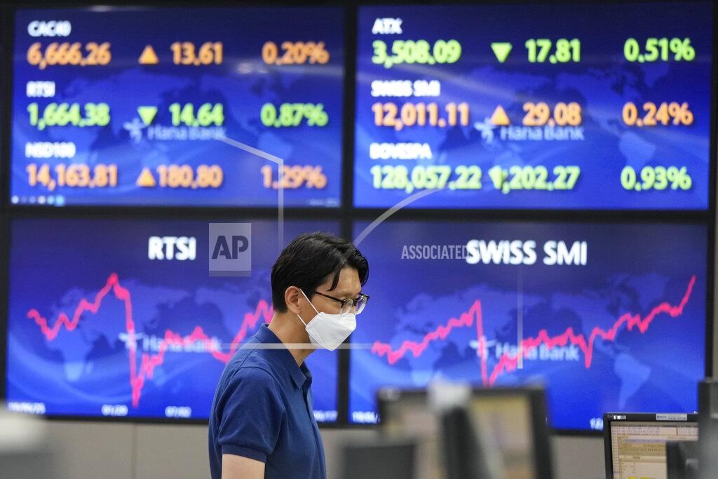 Ahn Young-Joon A currency trader watches monitors at the foreign exchange dealing room of the KEB Hana Bank headquarters in Seoul, South Korea, Friday, June 18, 2021. Asian shares mostly rose Friday, as investors digested the latest message from the U.S. Federal Reserve on raising short-term interest rates by late 2023. (AP Photo/Ahn Young-joon)