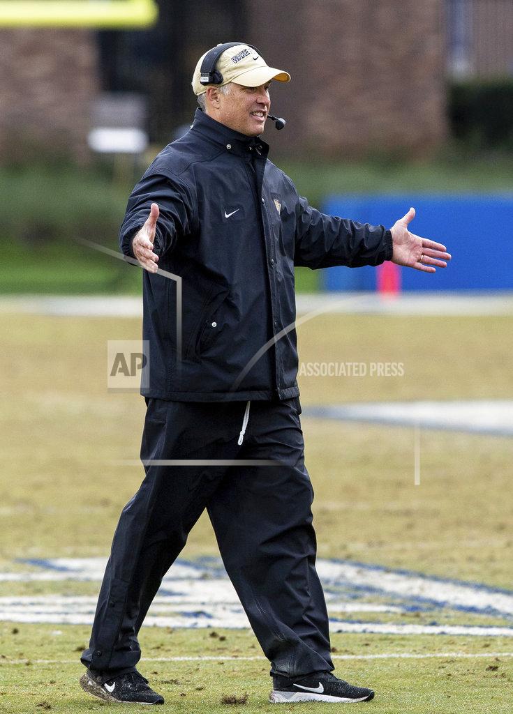 Ben Mckeown Wake Forest Head Coach Dave Clawson walks on the field to greet his players following a touchdown and extra point during the second half of an NCAA college football game against Duke in Durham, N.C., Saturday, Nov. 24, 2018. (AP Photo/Ben McKeown)
