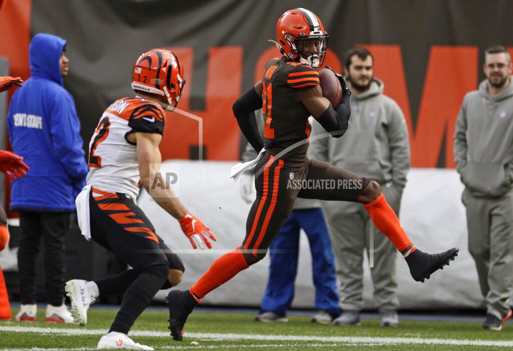 Cleveland Browns cornerback Denzel Ward scores on a 61-yard interception return during the first half of an NFL football game against the Cincinnati Bengals, Sunday, Dec. 8, 2019, in Cleveland. (AP Photo/Ron Schwane)