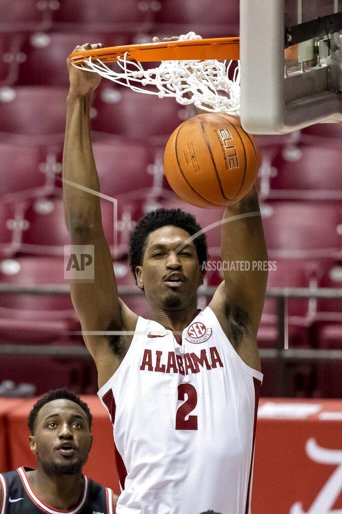 Vasha Hunt Alabama forward Jordan Bruner (2) dunks for two against Western Kentucky during the second half of an NCAA college basketball game, Saturday, Dec. 19, 2020, in Tuscaloosa, Ala. (AP Photo/Vasha Hunt)