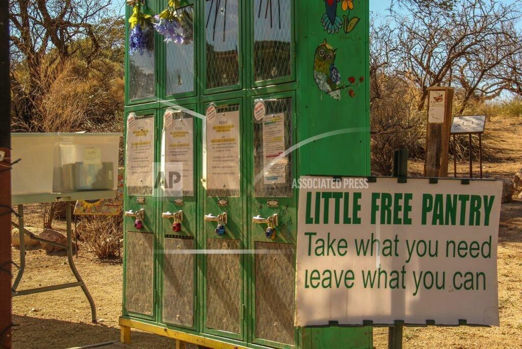 Travis Robertson Oracle residents have turned eight old school lockers, seen here on Feb. 26, 2021, into little pantries that serve one big purpose: fighting food insecurity in Oracle, Ariz. Oracle launched the project in September as a part of the Little Free Pantry movement, one of several efforts worldwide in which people donate food and goods and house them in a neighborhood space to be used by anyone who needs help. (Travis Robertson/Cronkite News via AP)