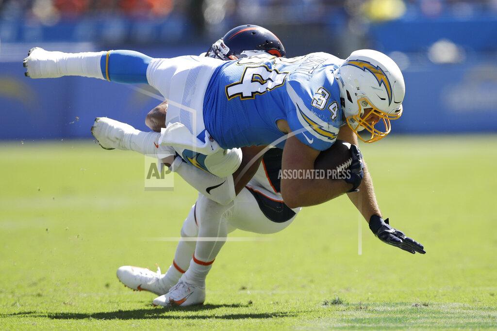 Marcio Jose Sanchez Los Angeles Chargers fullback Derek Watt is tackled by Denver Broncos cornerback Chris Harris during the first half of an NFL football game Sunday, Oct. 6, 2019, in Carson, Calif. (AP Photo/Marcio Jose Sanchez)