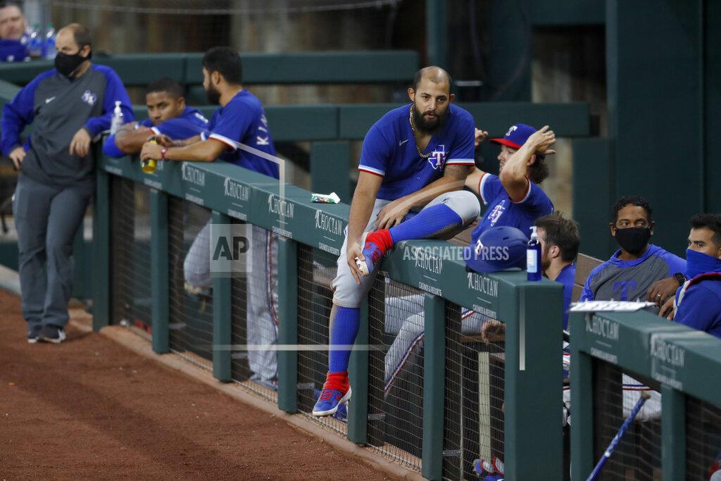 Tony Gutierrez Texas Rangers' Rougned Odor sits on the rail by other teammates in the dugout during an intrasquad practice baseball game at Globe Life Field in Arlington, Texas, Monday, July 6, 2020. (AP Photo/Tony Gutierrez)