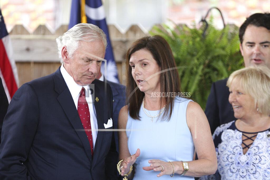 Jeffrey Collins South Carolina Gov. Henry McMaster, left, and Lt. Gov. Pamela Evette, right, talk after a ceremony to sign a bill preventing people from suing businesses over COVID-19 on Thursday, June 24, 2021 at Cafe Strudel in West Columbia, South Carolina. The bill signing was ceremonial after the General Assembly passed the legislation in April. (AP Photo/Jeffrey Collins).