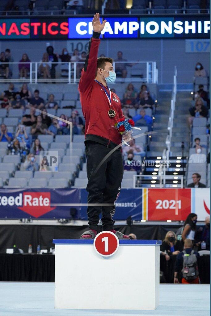 Tony Gutierrez Brody Malone acknowledges cheers from fans after being awarded first place in the men's overall during the U.S. Gymnastics Championships, Saturday, June 5, 2021, in Fort Worth, Texas. (AP Photo/Tony Gutierrez)