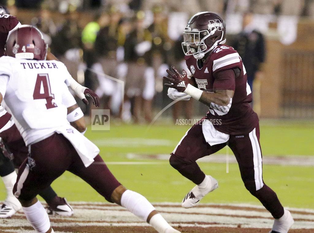 Jim Lytle Mississippi State running back Aeris Williams (26) looks for running room to avoid a tackle by Texas A&M defensive back Derrick Tucker (4) during the first half of their NCAA college football game on Saturday, Oct. 27, 2018, in Starkville, Miss. (AP Photo/Jim Lytle)