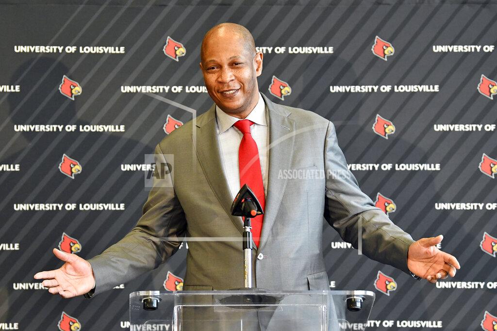 Timothy D. Easley Kenny Payne, new head coach of the Louisville NCAA men's college basketball team, gestures during an introductory press conference at the KFC Yum! Center in Louisville, Ky., Friday, March 18, 2022. (AP Photo/Timothy D. Easley)