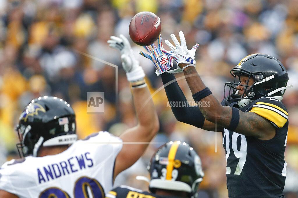 Don Wright Pittsburgh Steelers defensive back Kam Kelly (29) makes an interception in front of Baltimore Ravens tight end Mark Andrews (89) in the first half of an NFL football game, Sunday, Oct. 6, 2019, in Pittsburgh. (AP Photo/Don Wright)